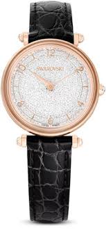 Swarovski Crystalline Wonder rose gold quartz watch with white sparkle dial and black leather strap