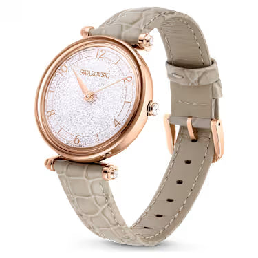 Swarovski Crystalline Wonder watch on wrist showing rose gold case and beige leather strap