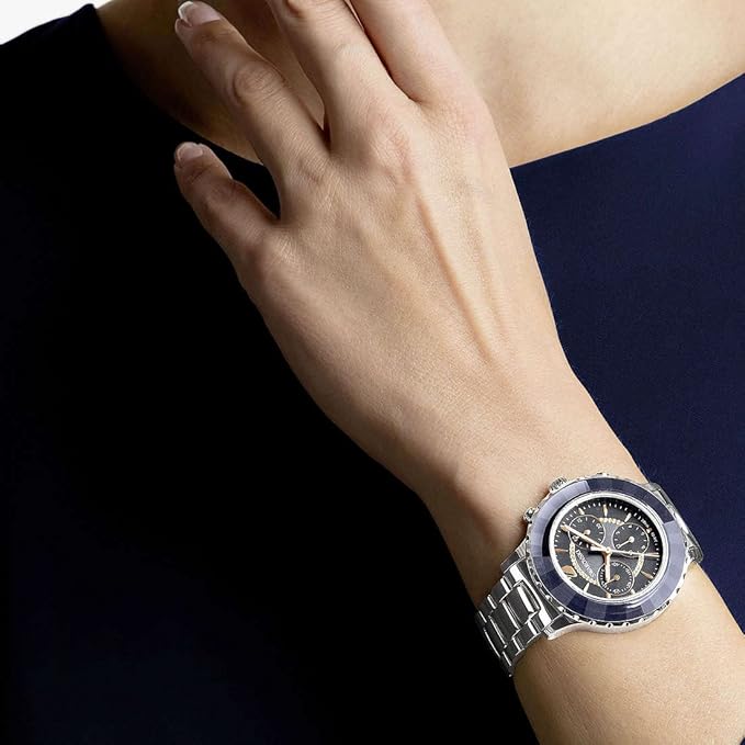 Swarovski Octea Lux Chrono worn on wrist showing silver case with navy dial and chronograph subdials