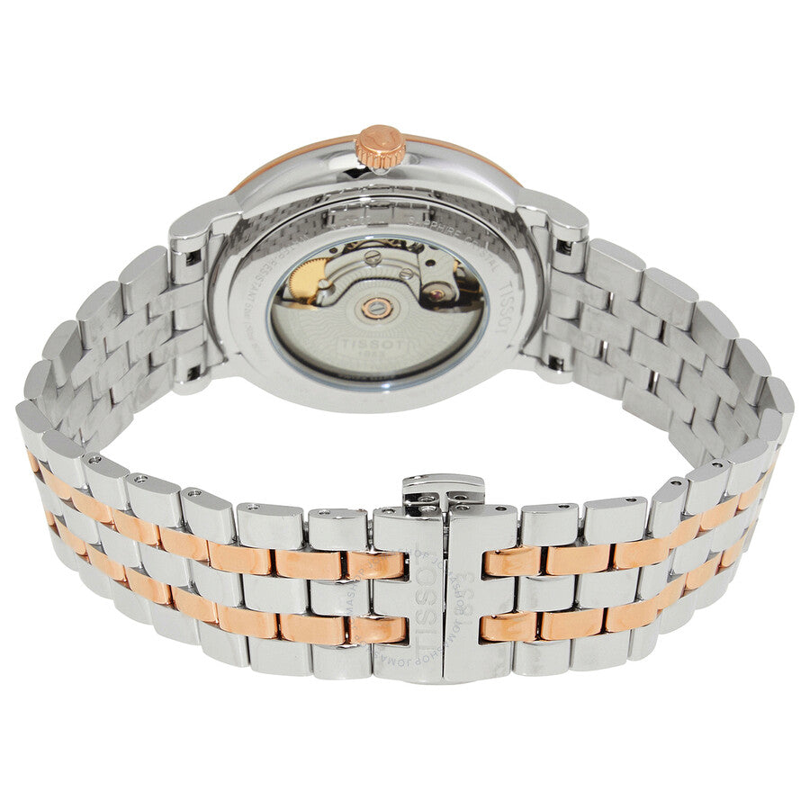 Caseback view of Tissot Carson automatic watch displaying visible movement and two-tone bracelet