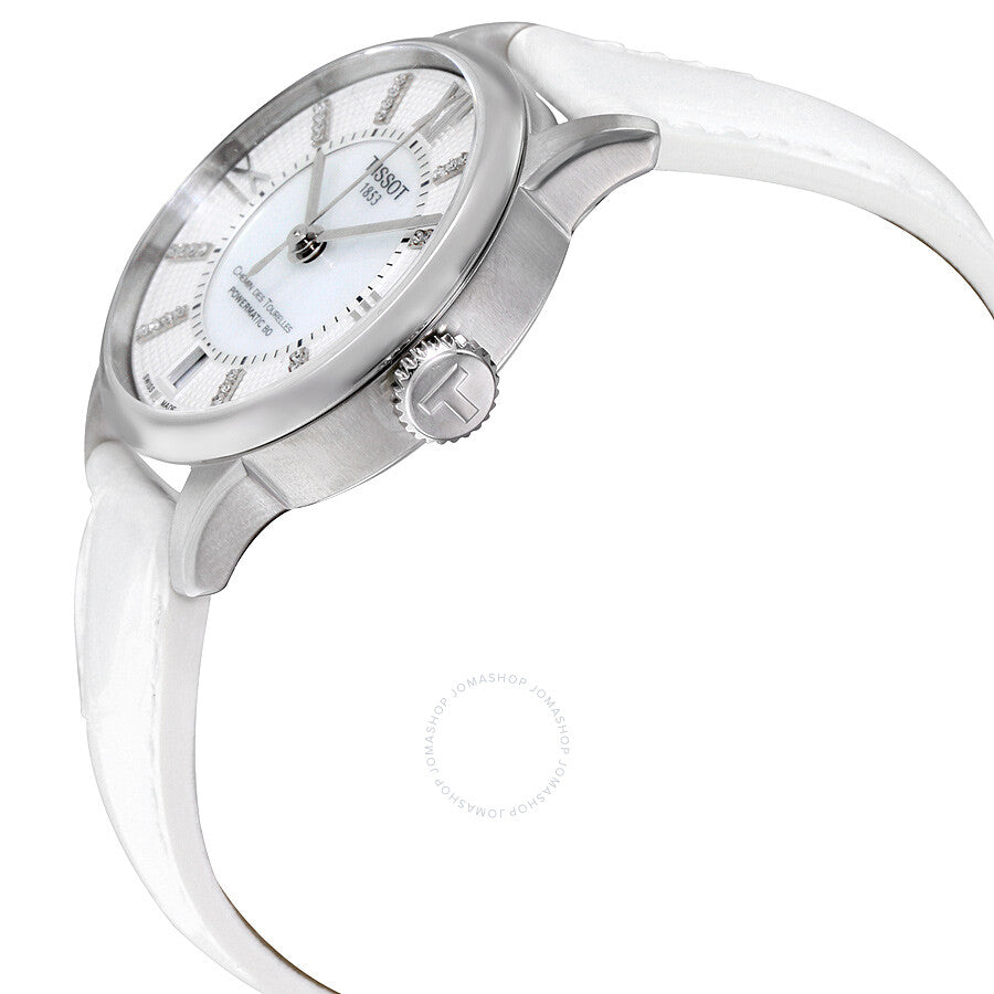 Tissot Chemin Des Tourelles watch shown at angle with stainless steel case and white strap