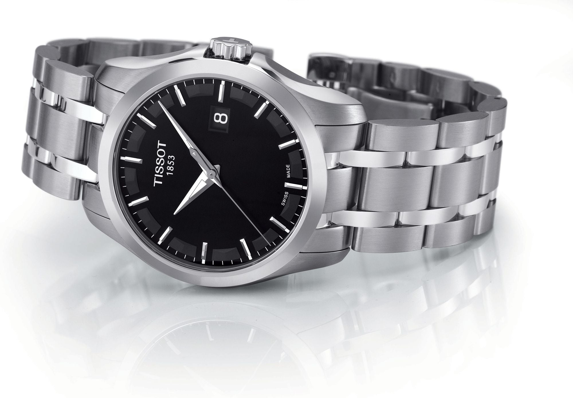 Tissot Couturier watch with stainless steel bracelet and black dial on white background