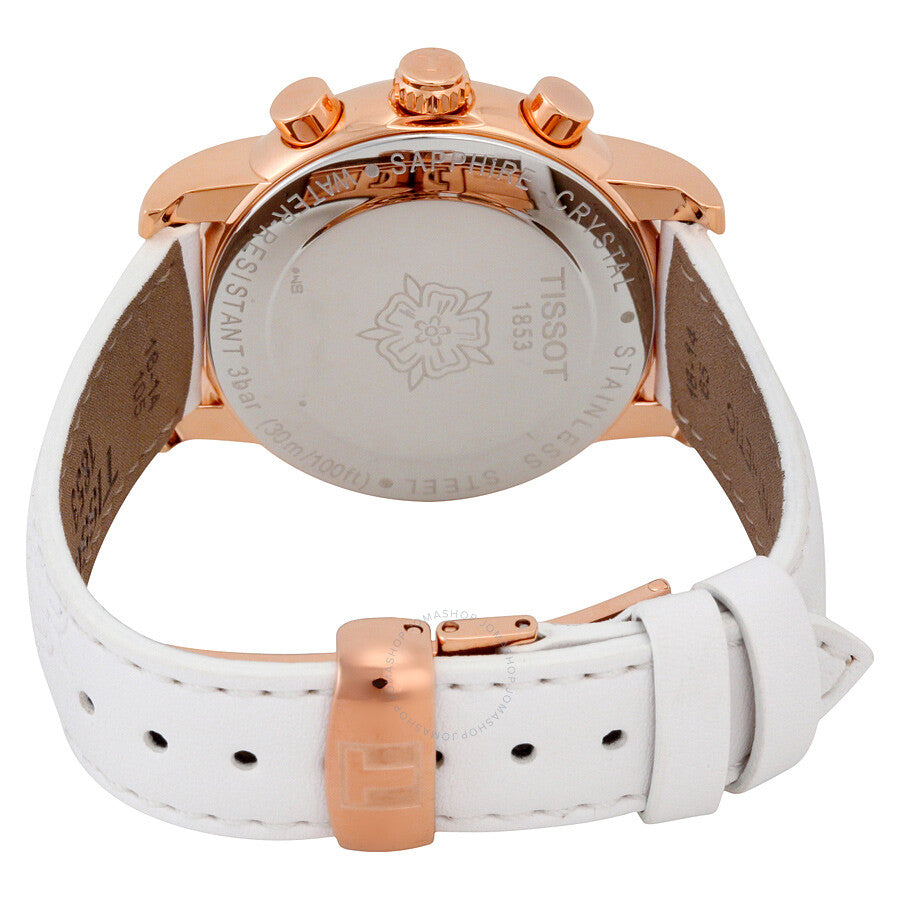 Caseback of Tissot Dressport watch showing Tissot branding and white leather strap