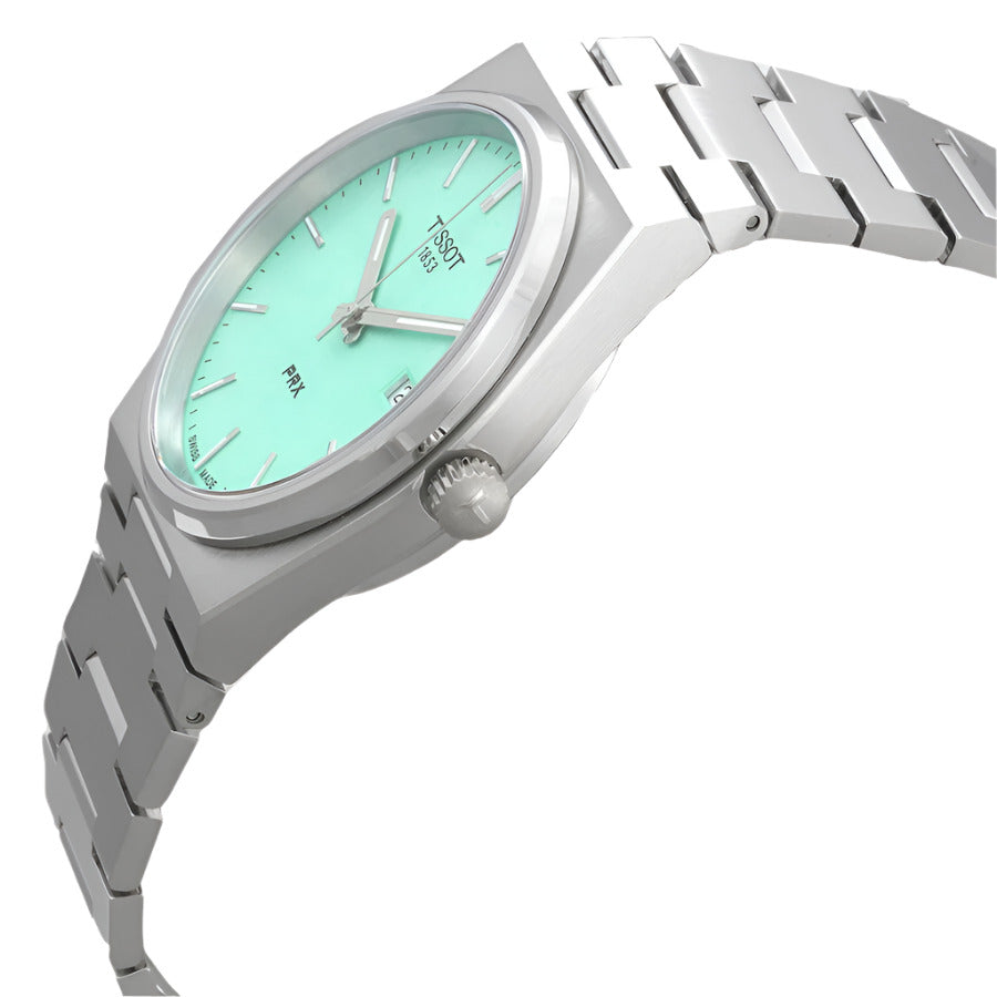 Tissot PRX watch shown at angle displaying light green dial and stainless steel bracelet