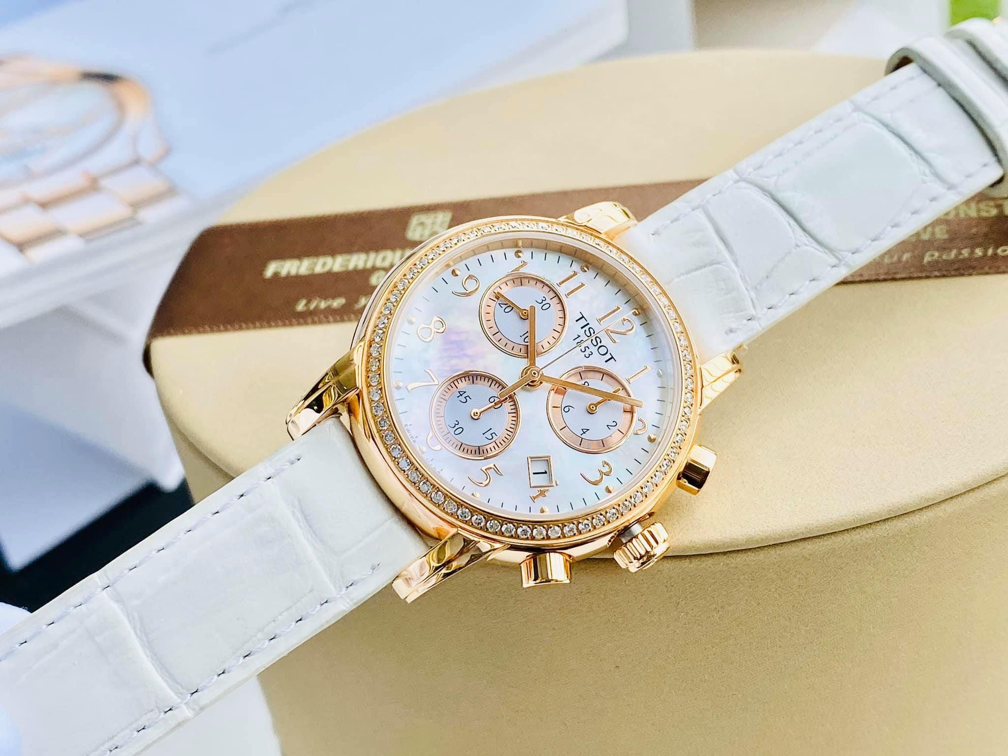 Tissot T-Classic Dressport chronograph worn on wrist with white leather strap