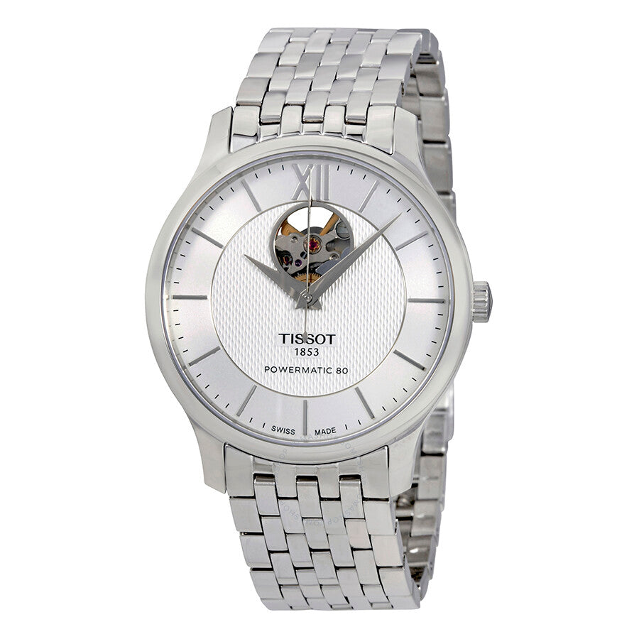 Tissot Tradition automatic men's watch with silver dial, Roman numerals, and visible balance wheel