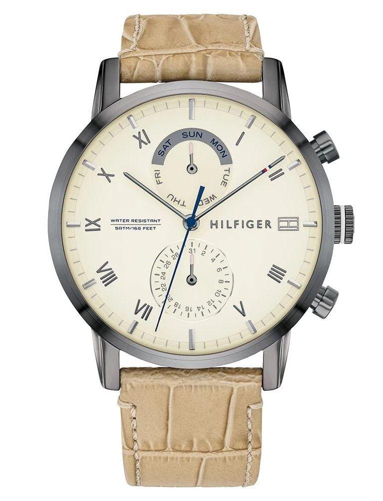 Tommy Hilfiger multi-function watch with cream dial, Roman numerals, chronograph subdials, and tan leather strap