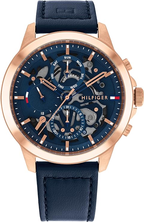 Tommy Hilfiger chronograph watch with rose gold case, blue dial, and navy leather strap