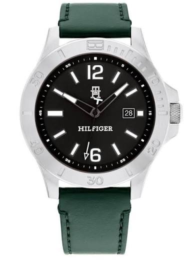 Tommy Hilfiger 46mm quartz watch with silver case, black dial, and green leather strap