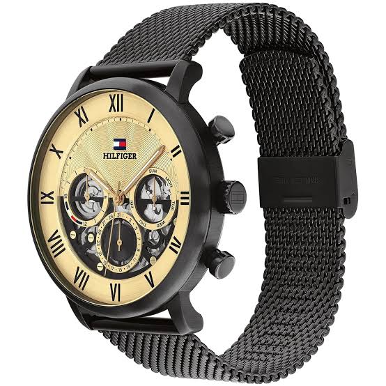 Side view of Tommy Hilfiger watch showing black mesh strap and case profile