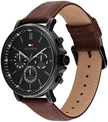 Angled view of Tommy Hilfiger chronograph with black case and brown leather strap