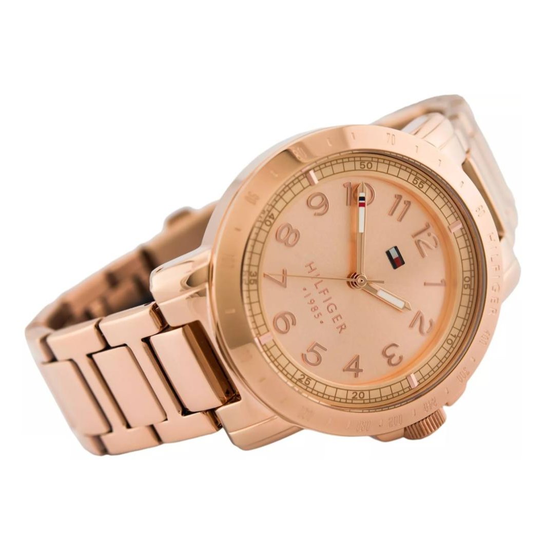Tommy Hilfiger rose gold women's watch on wrist, side angle view with rose gold bracelet