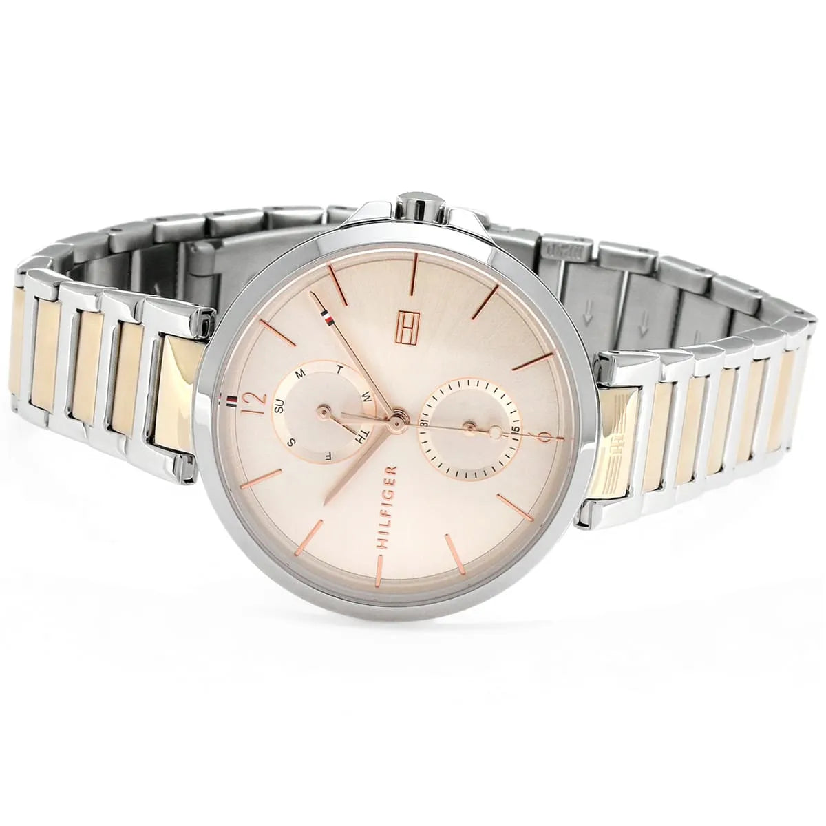 Tommy Hilfiger women's quartz watch with rose gold dial on wrist, two-tone bracelet