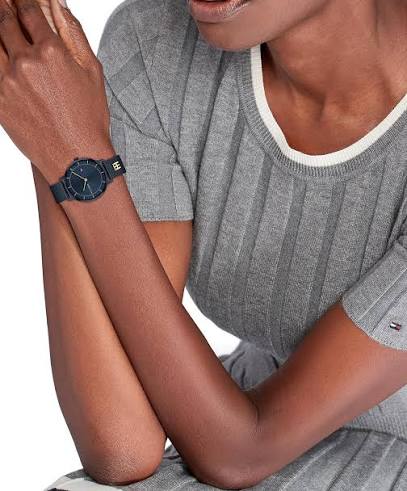 Tommy Hilfiger blue watch on woman's wrist