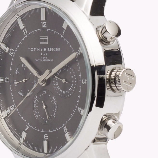 Tommy Hilfiger watch side angle showing silver case and chronograph pushers