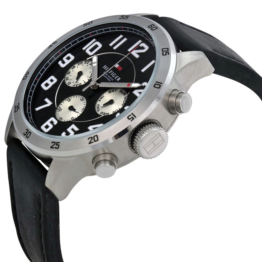 Side angle view of Tommy Hilfiger chronograph watch showing stainless steel case and black leather strap
