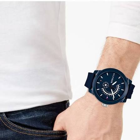 Tommy Hilfiger sport watch worn on wrist with navy silicone strap