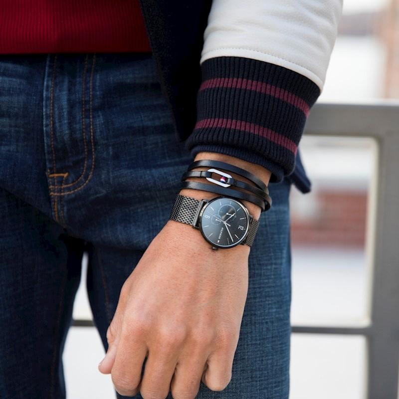 Tommy Hilfiger all-black mesh watch worn on wrist with casual styling