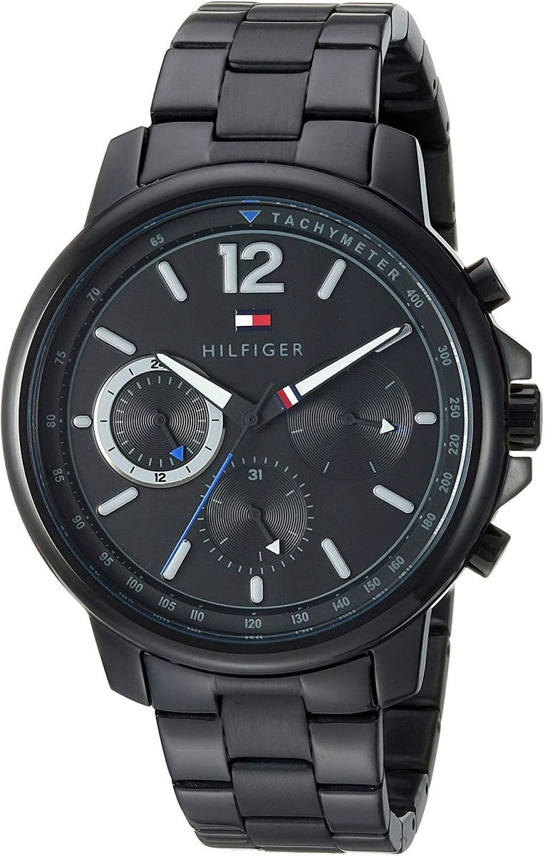 Tommy Hilfiger chronograph watch with black dial, white hour markers, and black stainless steel bracelet