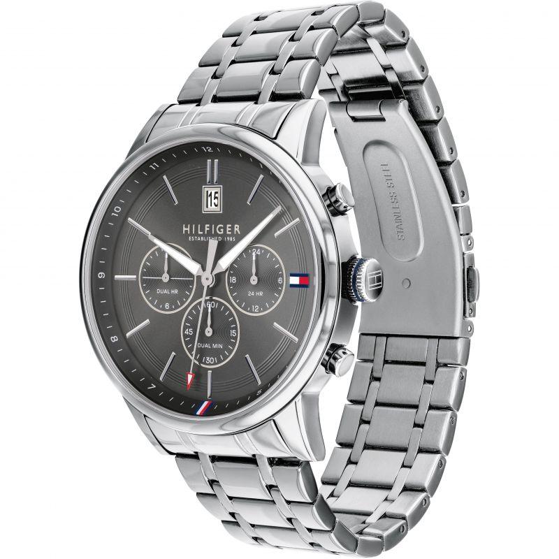 Tommy Hilfiger men's watch shown from angled side view with grey dial and steel bracelet