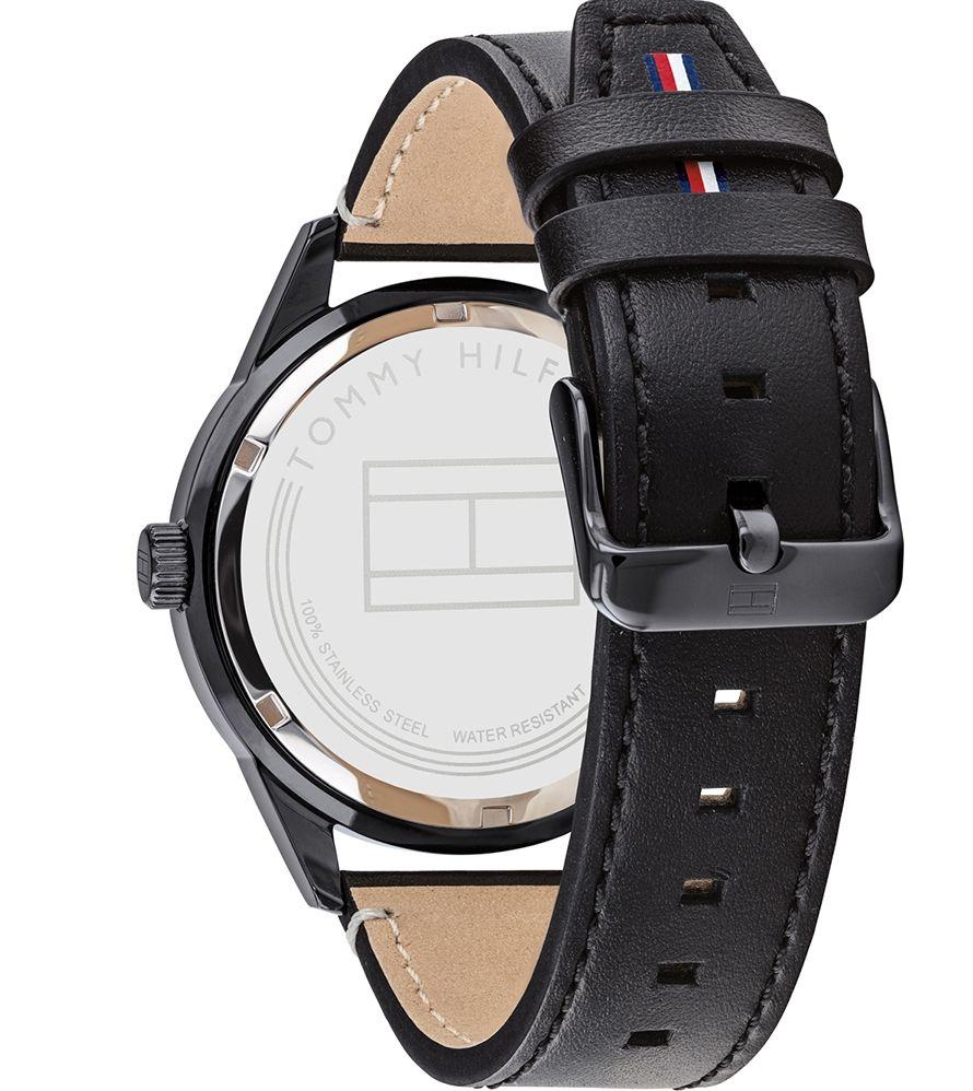 Tommy Hilfiger watch caseback displaying engraved branding and black leather strap
