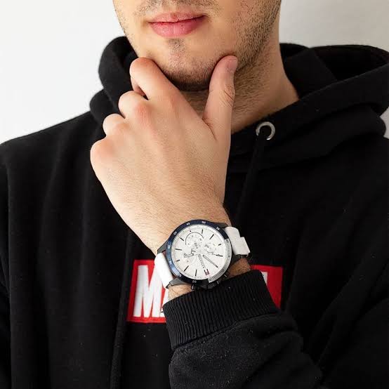 Tommy Hilfiger chronograph watch worn on wrist showing white dial and strap