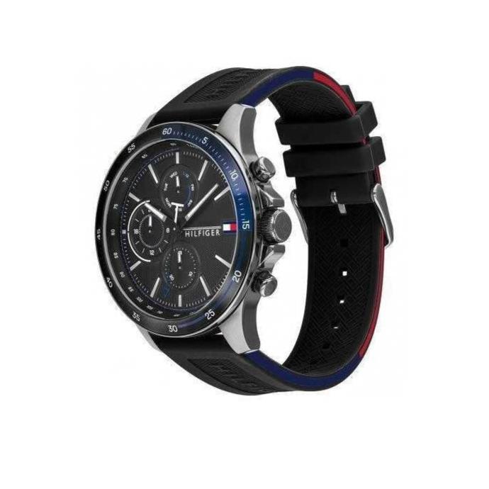 Tommy Hilfiger chronograph watch angled view showing black rubber strap with blue and red accents