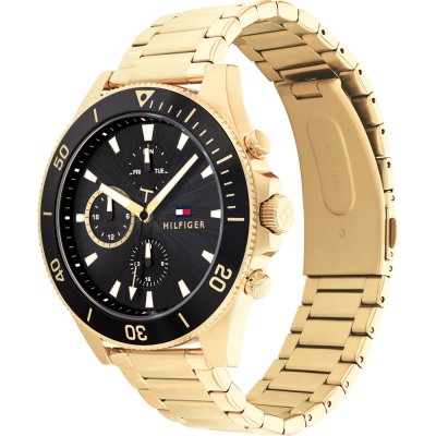 Tommy Hilfiger gold watch shown at angle displaying side of bracelet