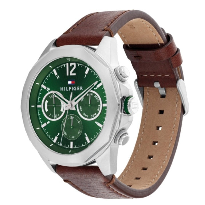 Tommy Hilfiger chronograph watch shown at angle displaying silver case and brown leather strap