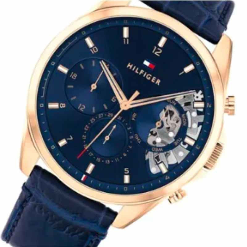 Tommy Hilfiger Baker multifunction watch angled view showing rose gold case and blue dial