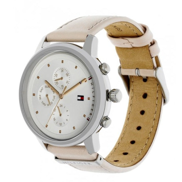 Tommy Hilfiger Blake watch angled view showing silver case, white dial, and interchangeable tan leather strap