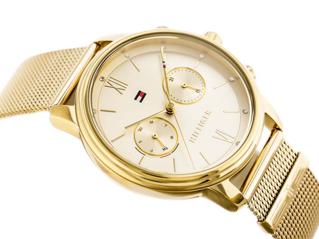 Tommy Hilfiger Blake gold watch worn on wrist showing champagne dial and bracelet