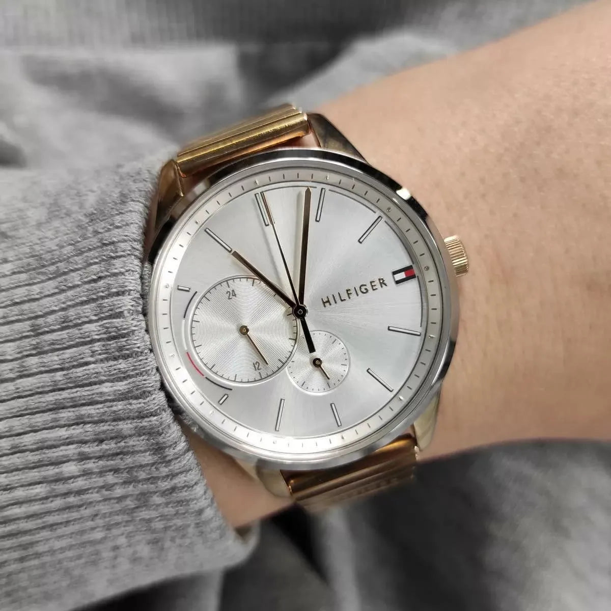 Tommy Hilfiger Brooke watch worn on wrist showing white dial with dual subdials