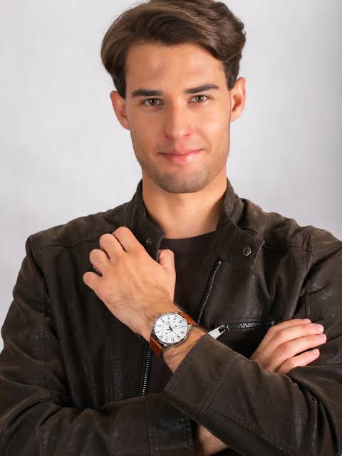 Man wearing Tommy Hilfiger brown leather chronograph watch on wrist
