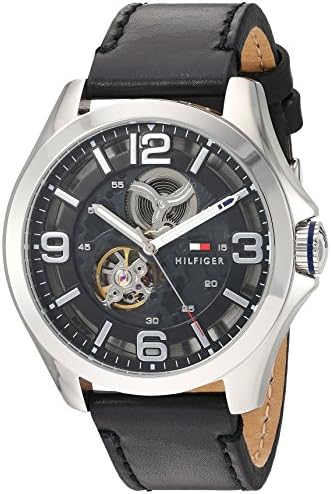 Tommy Hilfiger Bruce watch displayed at angle showing black leather strap with tan inner lining
