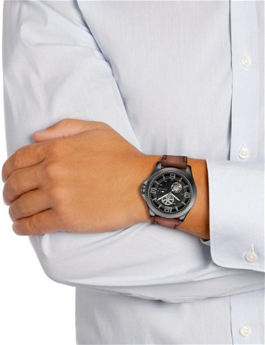 Tommy Hilfiger Bruce automatic watch worn on wrist with brown leather strap