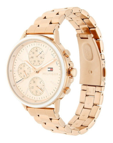 Side view of Tommy Hilfiger Carly watch showing rose gold case, dial, and linked steel strap