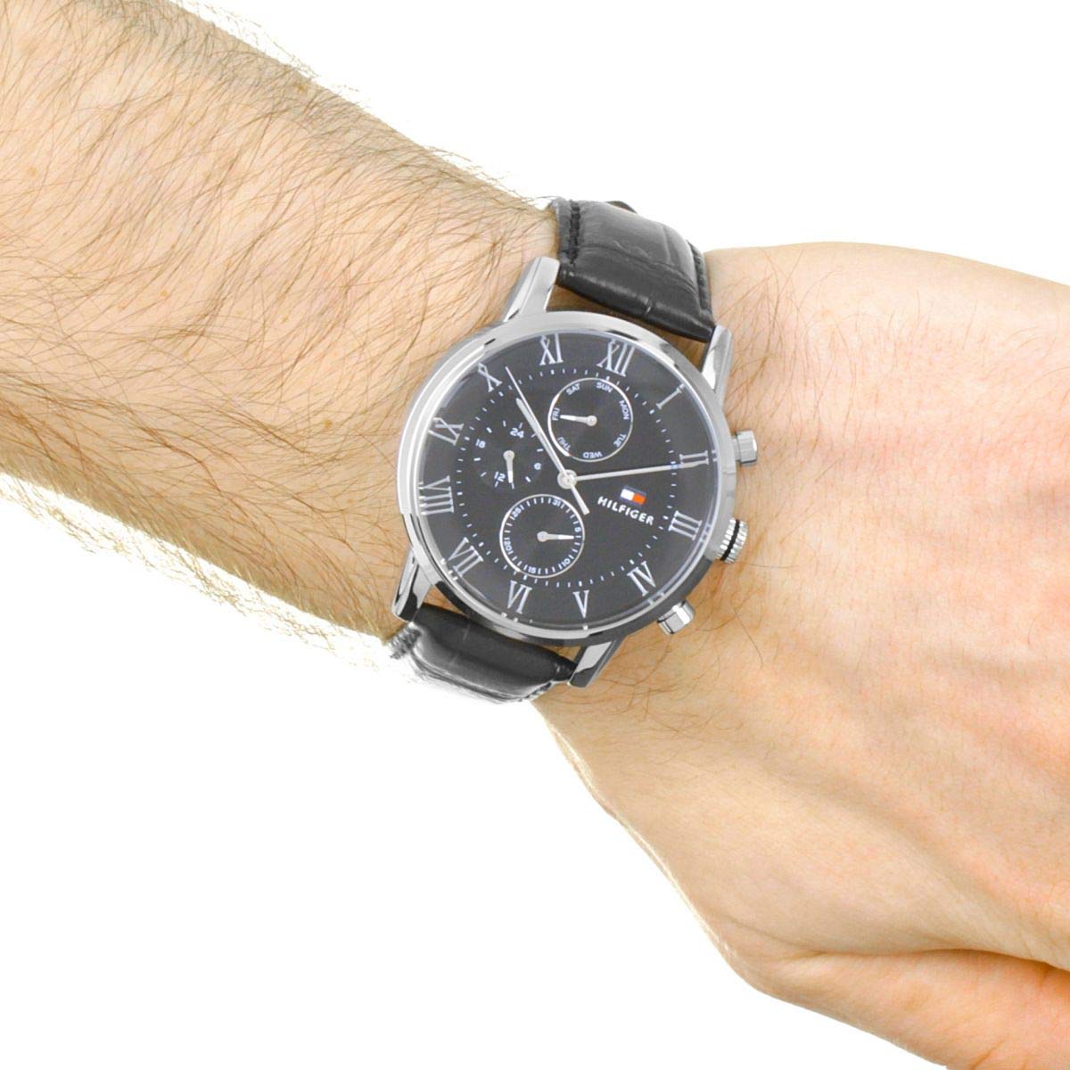 Tommy Hilfiger chronograph watch worn on wrist with black leather strap