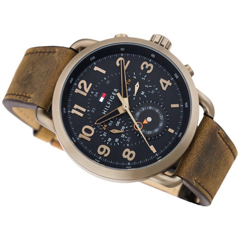 Tommy Hilfiger chronograph watch at 45-degree angle showing black dial and brown leather strap