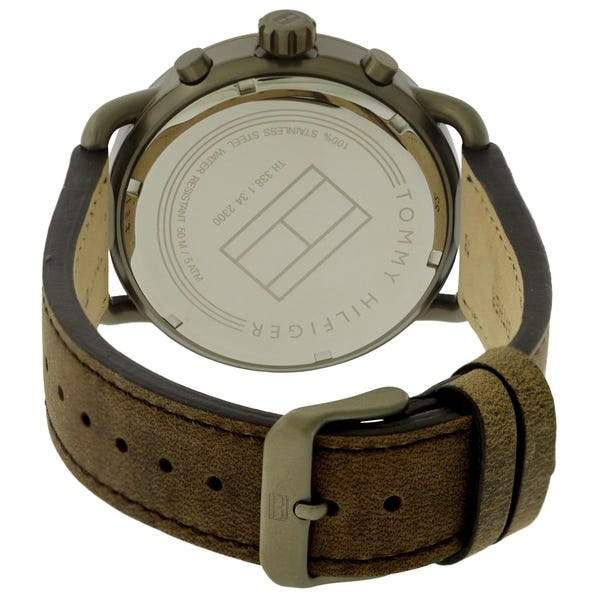 Tommy Hilfiger watch caseback showing engraved text and brown leather strap with buckle