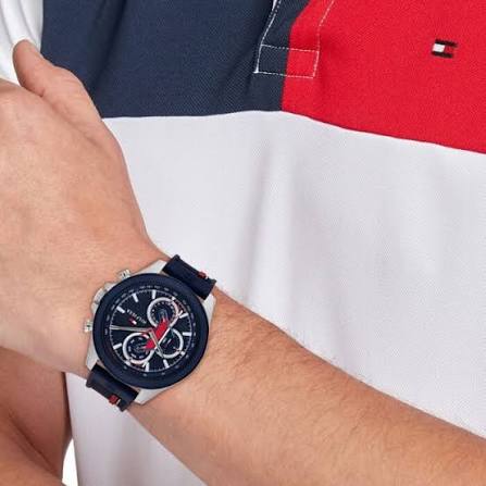 Tommy Hilfiger Clark watch worn on wrist showing blue and red silicone strap