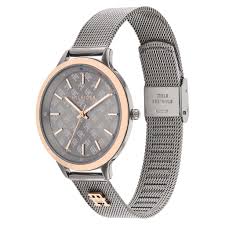 Side angle view of Tommy Hilfiger Damon watch showing mesh bracelet and rose gold case
