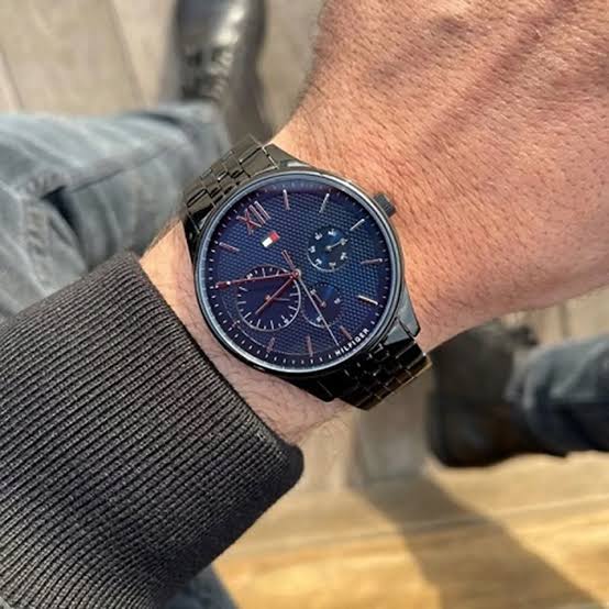 Tommy Hilfiger Damon chronograph watch worn on wrist with black steel band