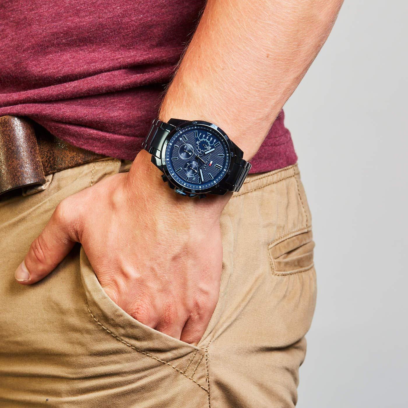 Tommy Hilfiger Decker chronograph watch worn on wrist, showcasing blue dial and steel bracelet