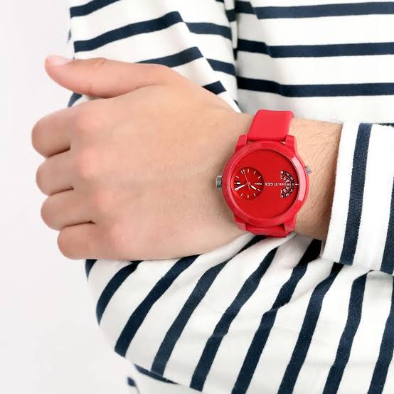 Tommy Hilfiger Denim Sport red watch worn on wrist, displaying dual dial design