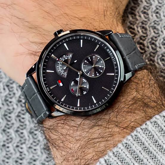 Tommy Hilfiger Dressed Up chronograph watch worn on wrist with black leather strap