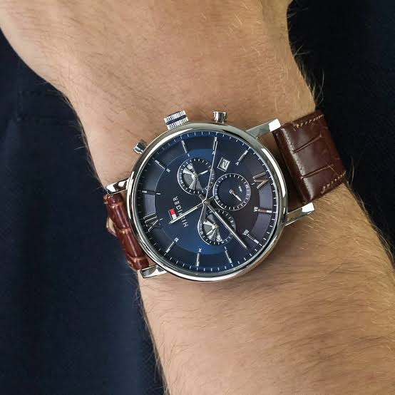 Tommy Hilfiger Evan chronograph watch worn on wrist with brown leather strap