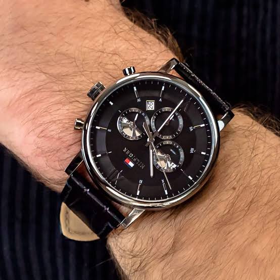 Tommy Hilfiger Evan chronograph watch worn on wrist with black leather strap