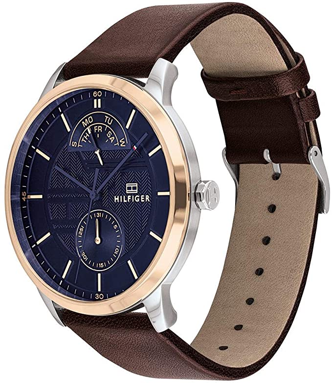 Tommy Hilfiger Hunter watch angle view showing two-tone case, navy dial, and brown leather strap