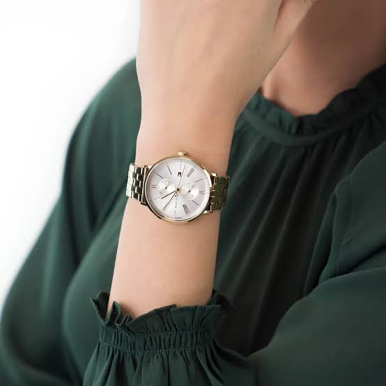 Tommy Hilfiger Jenna watch worn on wrist with gold-tone case and white dial